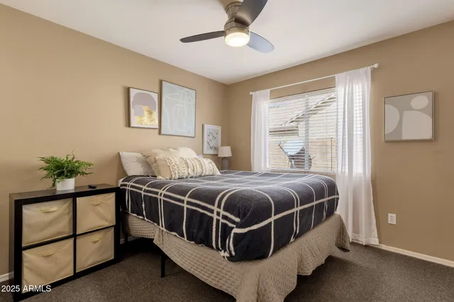 a bedroom with bed and a window