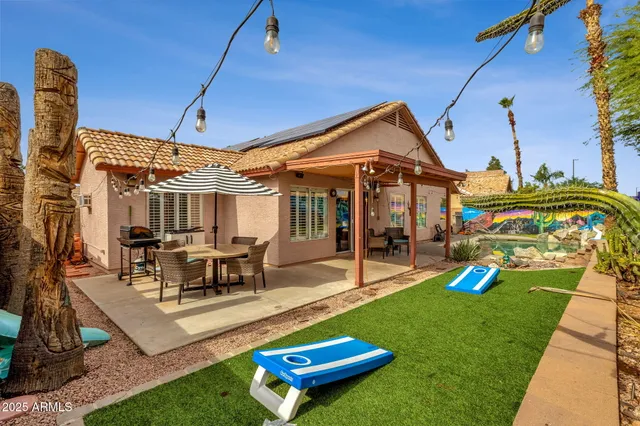 a backyard of a house with seating space