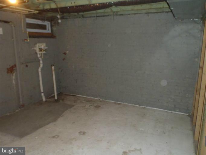 26 Midship Road Dundalk, MD 21222 - Photo 5 of 30 a view of a room with racks on the wall