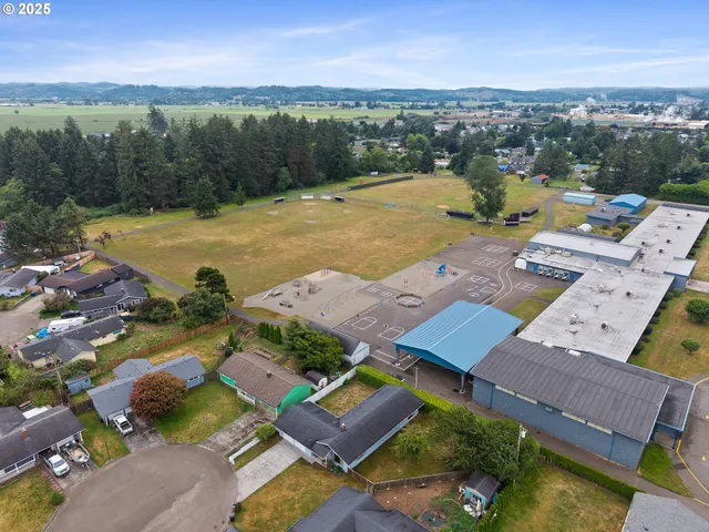 an aerial view of residential houses with outdoor space