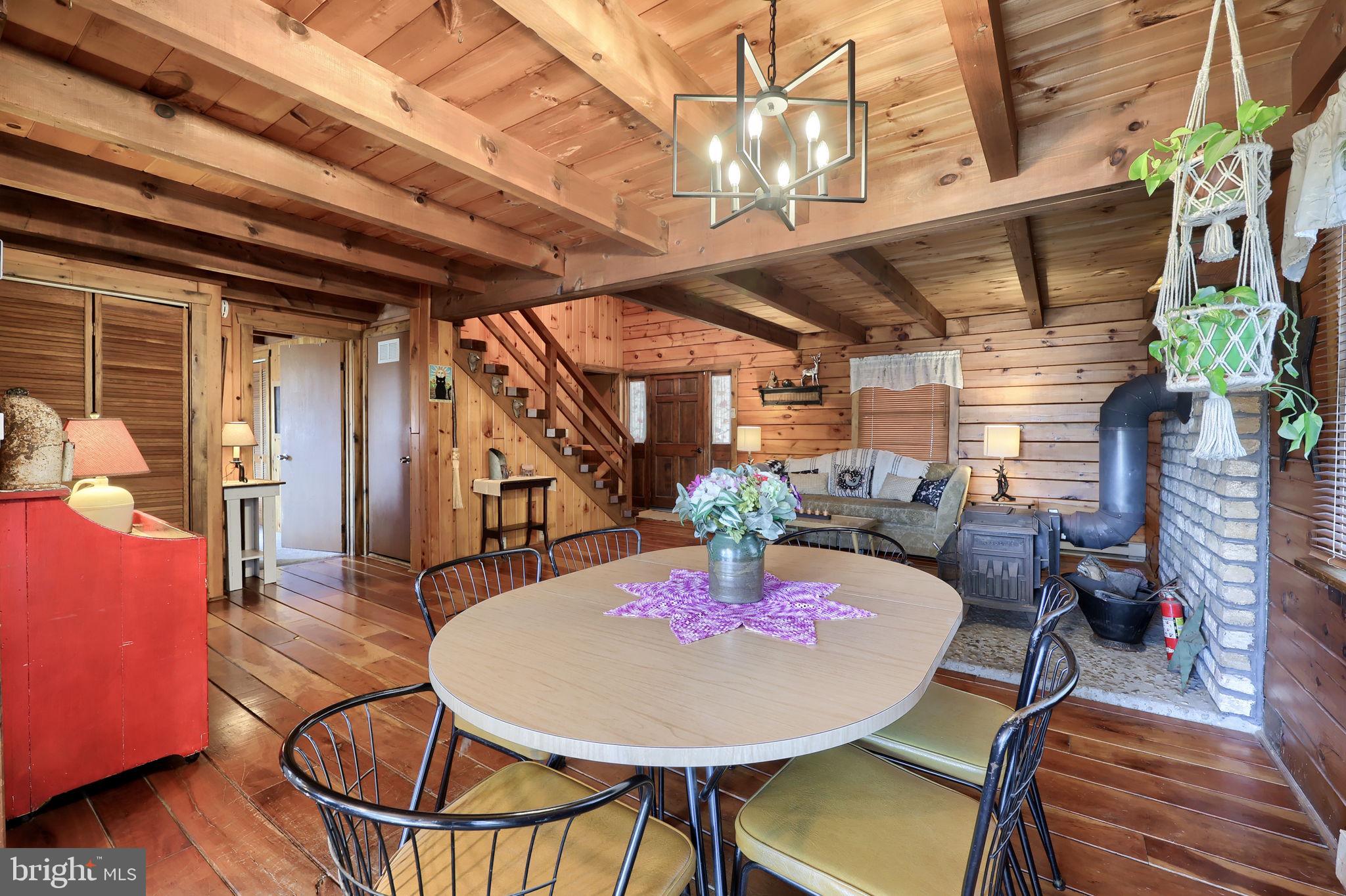 149 Douts Hill Road Holtwood, PA 17532 - Photo 13 of 77 a dining room with furniture a chandelier and wooden floor
