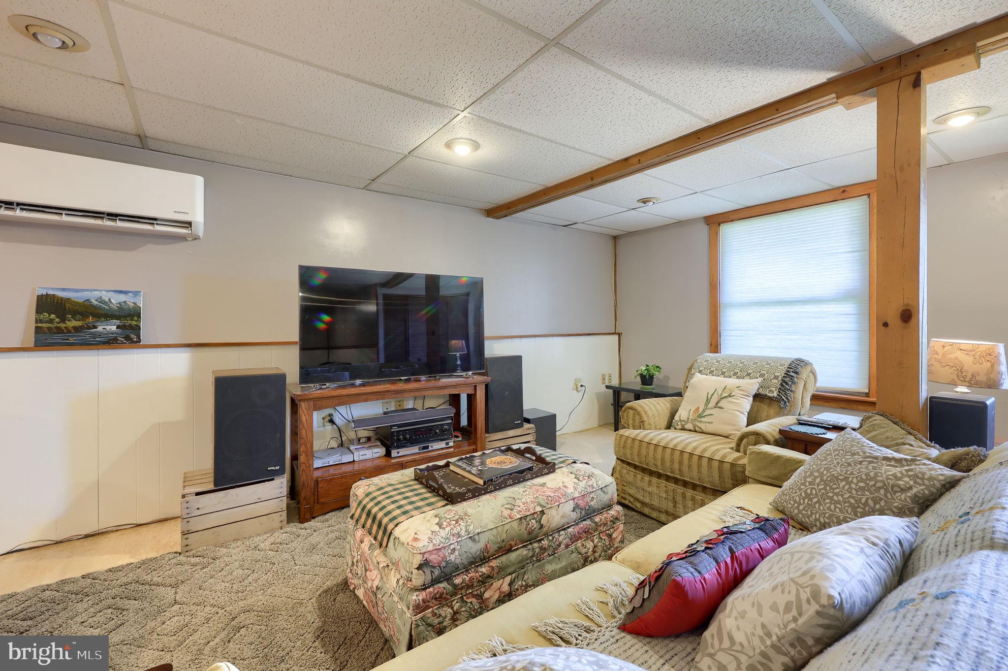 149 Douts Hill Road Holtwood, PA 17532 - Photo 35 of 77 a living room with furniture and a flat screen tv
