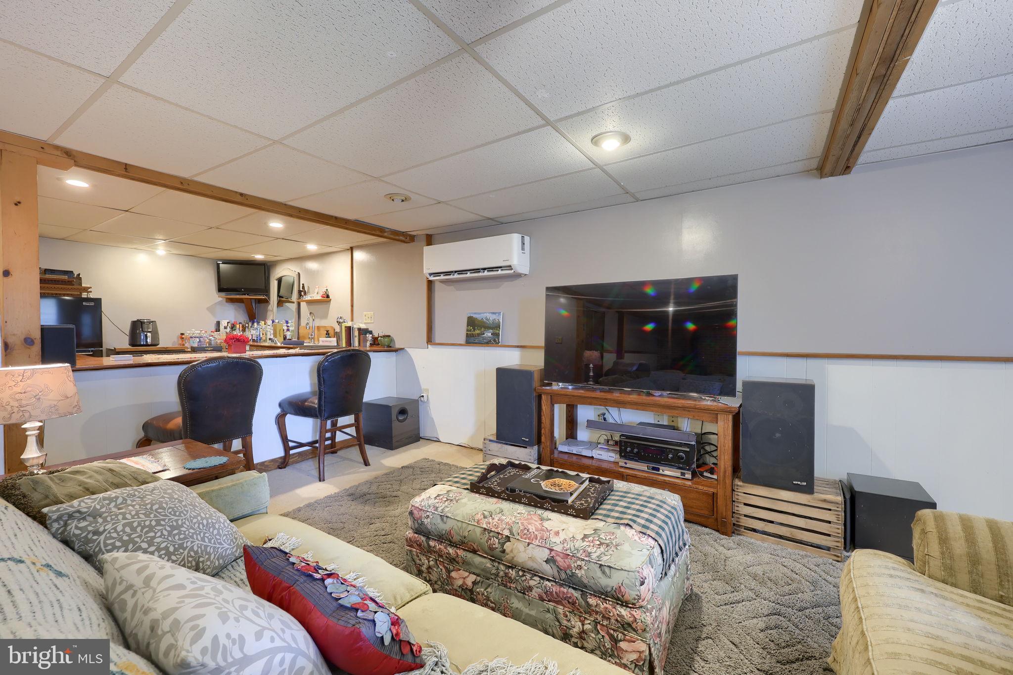 149 Douts Hill Road Holtwood, PA 17532 - Photo 36 of 77 a living room with furniture and a flat screen tv