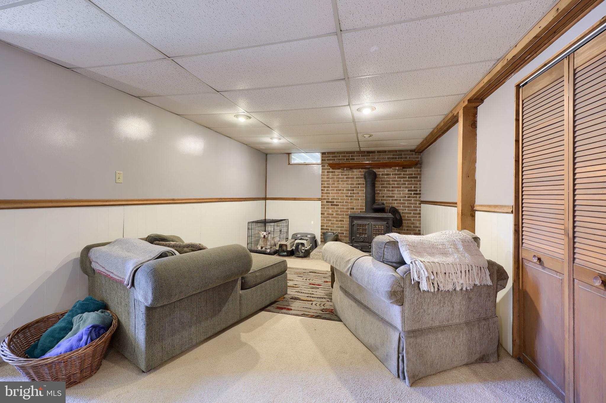 149 Douts Hill Road Holtwood, PA 17532 - Photo 39 of 77 a living room with furniture ceiling fan and a rug