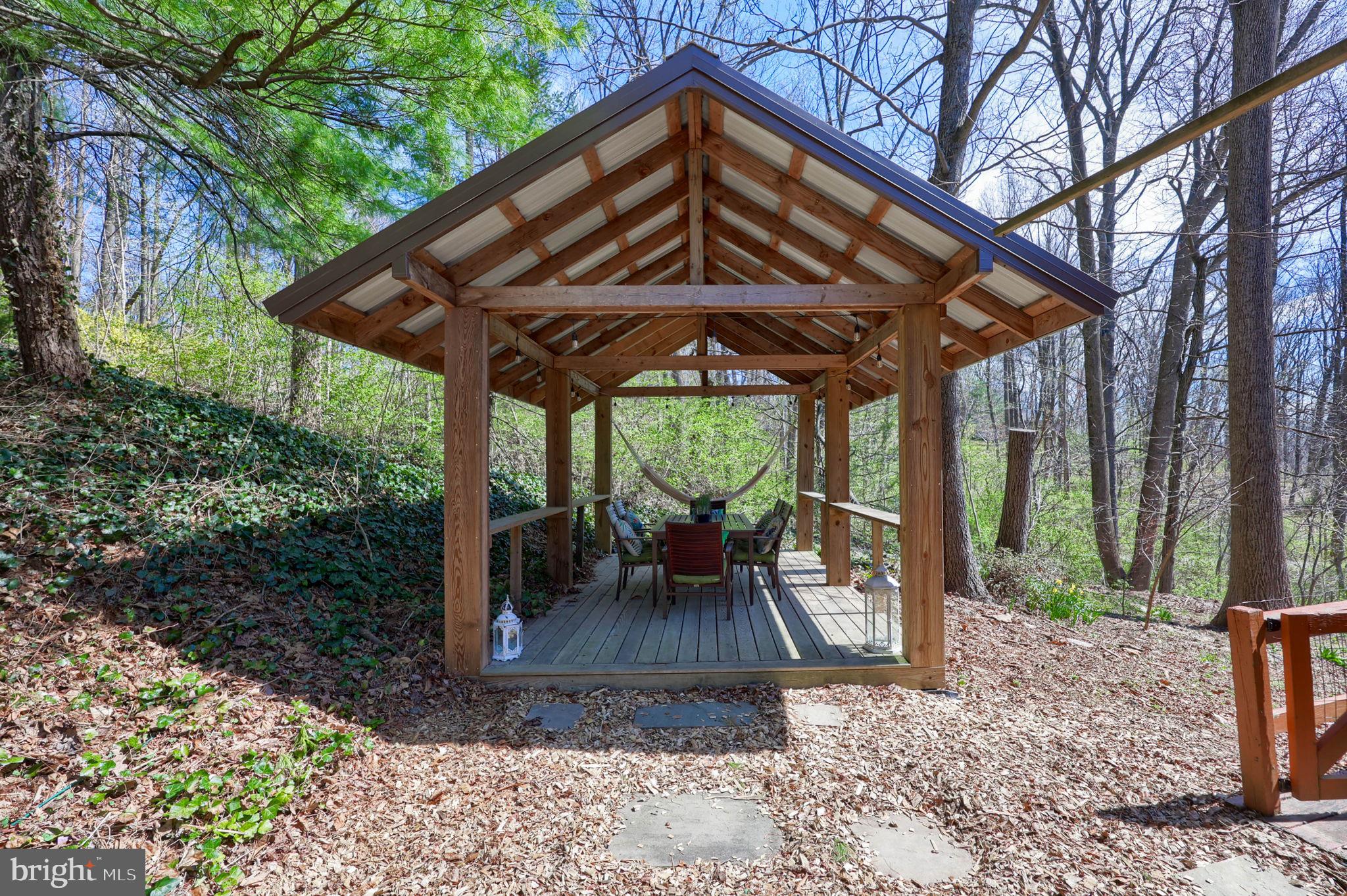 149 Douts Hill Road Holtwood, PA 17532 - Photo 43 of 77 a view of a patio with a table chairs and a backyard