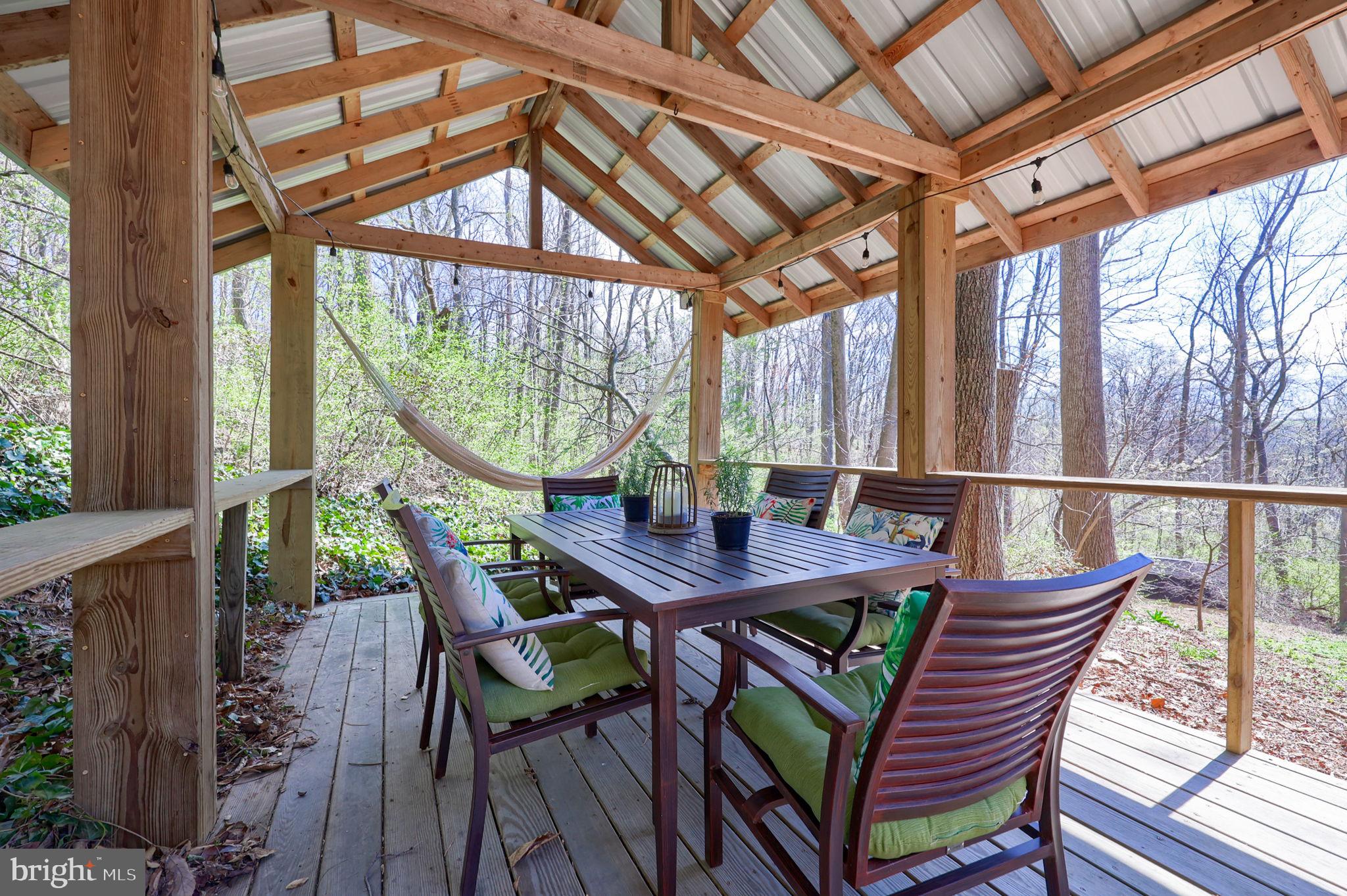 149 Douts Hill Road Holtwood, PA 17532 - Photo 44 of 77 a view of a patio with a table chairs and a backyard