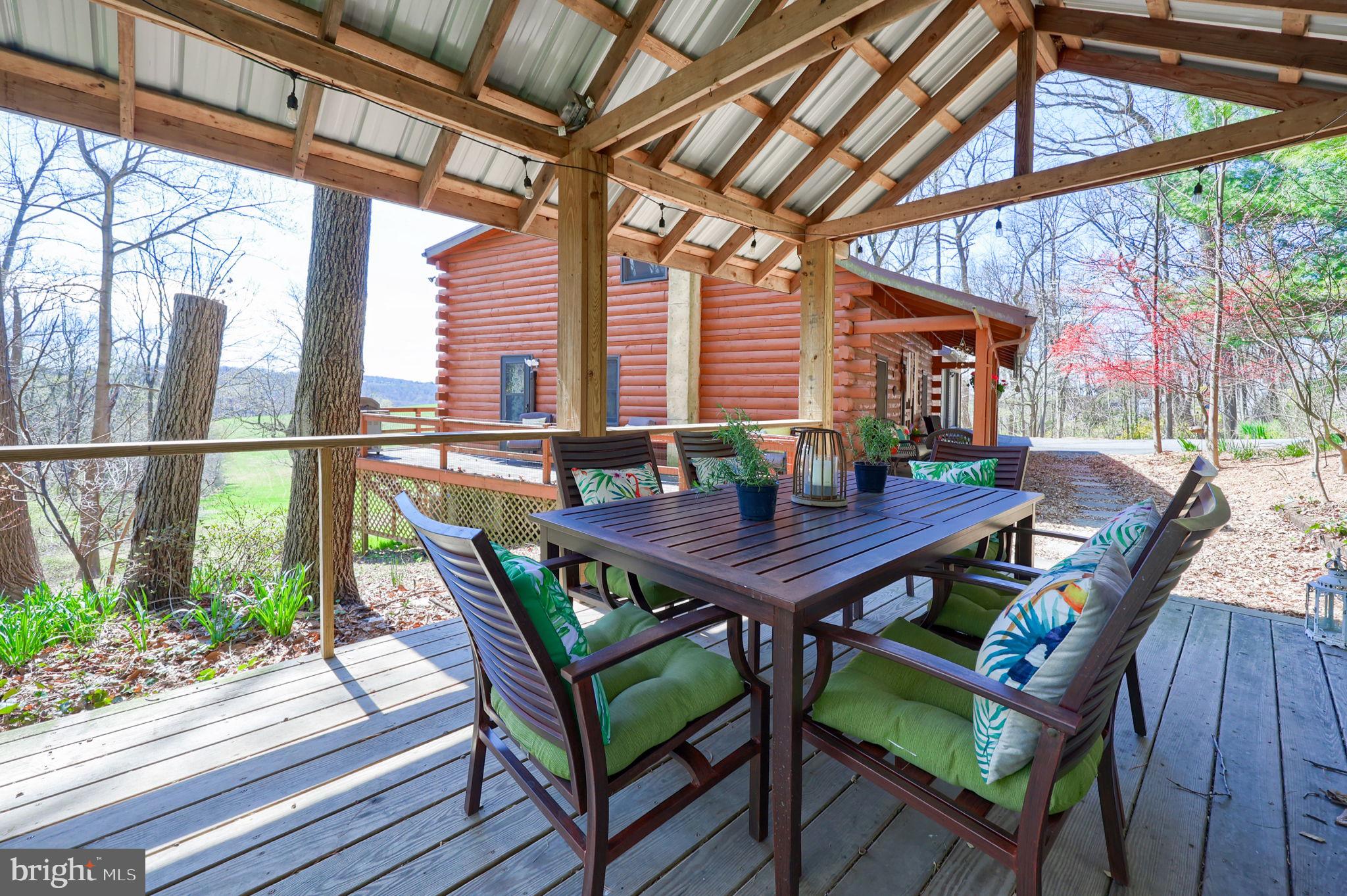 149 Douts Hill Road Holtwood, PA 17532 - Photo 45 of 77 a view of a patio with a table and chairs