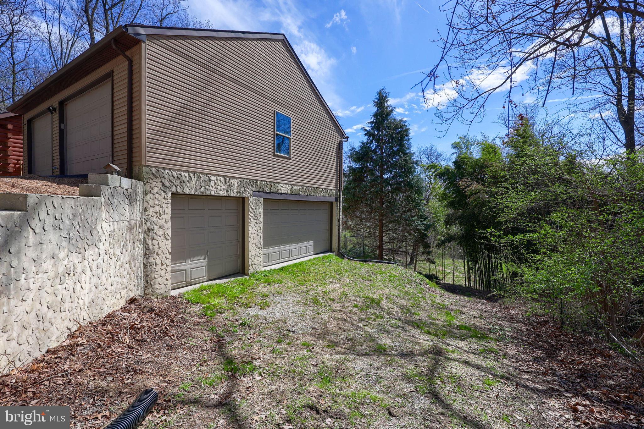 149 Douts Hill Road Holtwood, PA 17532 - Photo 50 of 77 a front view of a house with a yard and garage