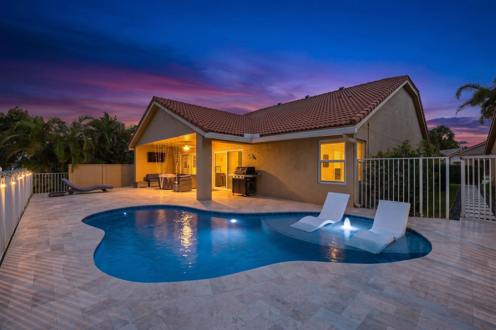 7403 Shell Ridge Terrace Lake Worth, FL 33467 - Photo 1 of 37 a view of a swimming pool with a patio