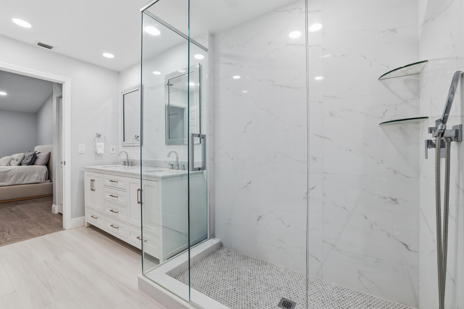 7403 Shell Ridge Terrace Lake Worth, FL 33467 - Photo 14 of 37 a bathroom with a shower sink and mirror