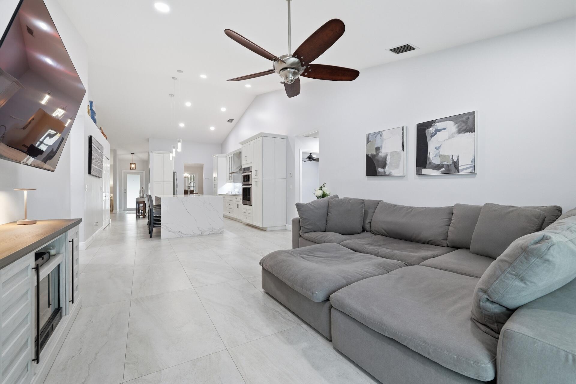 7403 Shell Ridge Terrace Lake Worth, FL 33467 - Photo 10 of 37 a living room with furniture and kitchen view