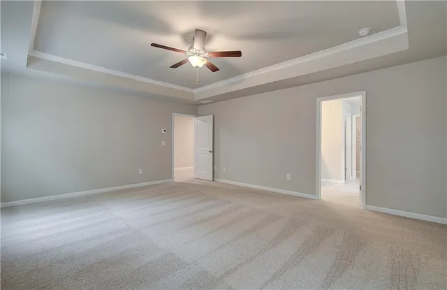 a spacious bathroom with a shower and a sink