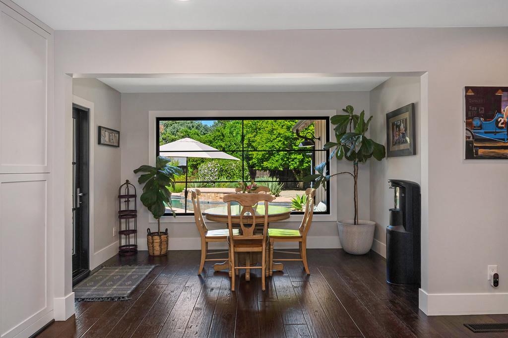 38318 Larue Way Davis, CA 95616 - Photo 16 of 92 a dining room with furniture and a floor to ceiling window