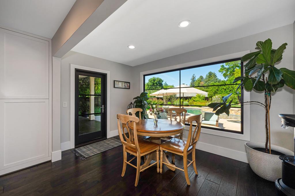 38318 Larue Way Davis, CA 95616 - Photo 18 of 92 a dining room with furniture potted plants and wooden floor