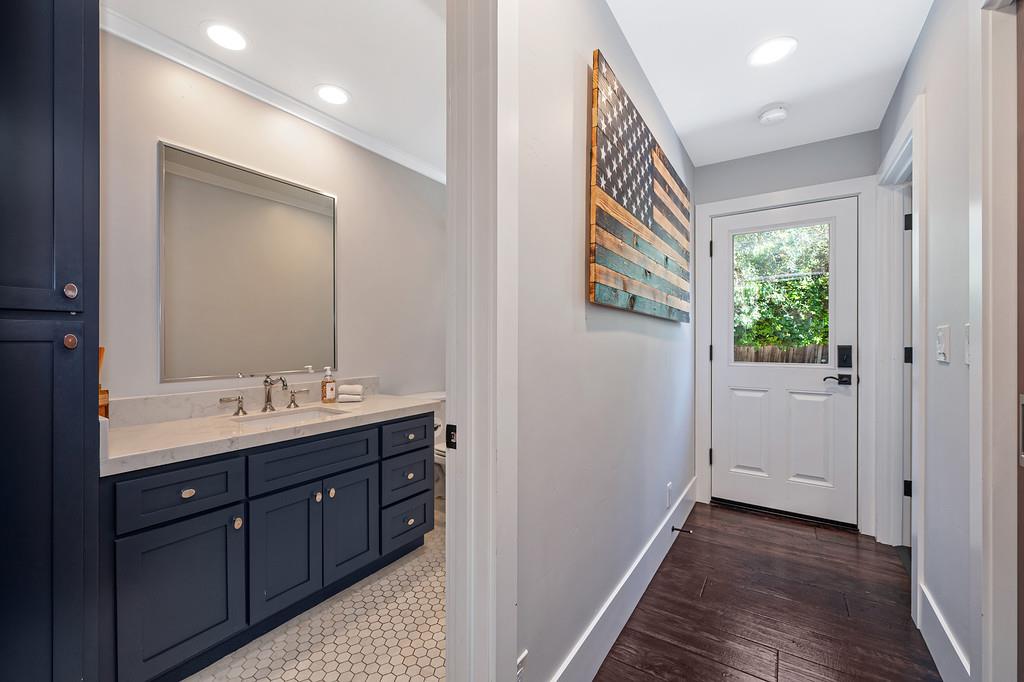 38318 Larue Way Davis, CA 95616 - Photo 34 of 92 a bathroom with a sink a mirror and a window