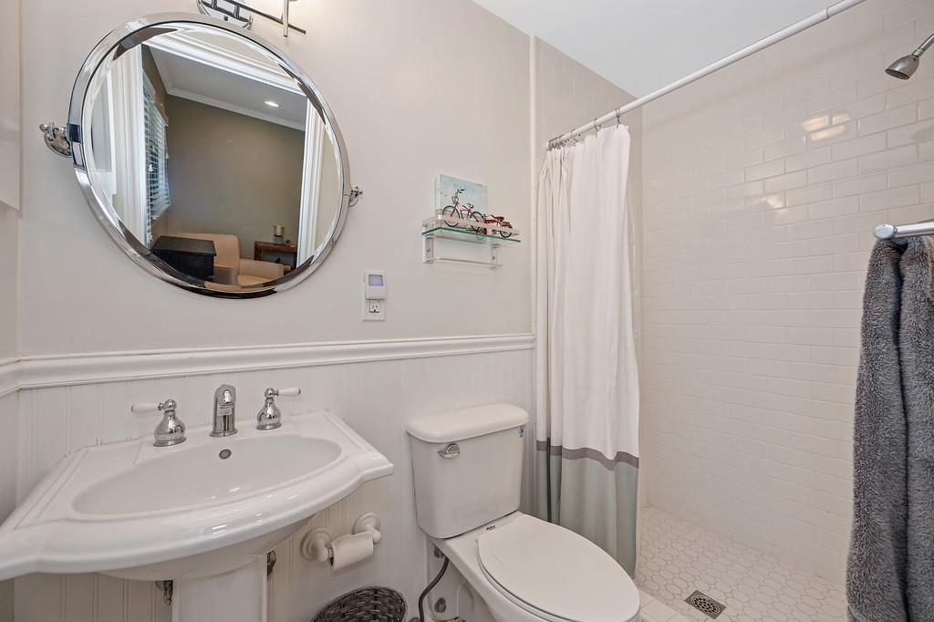 38318 Larue Way Davis, CA 95616 - Photo 38 of 92 a bathroom with a sink a toilet and a mirror