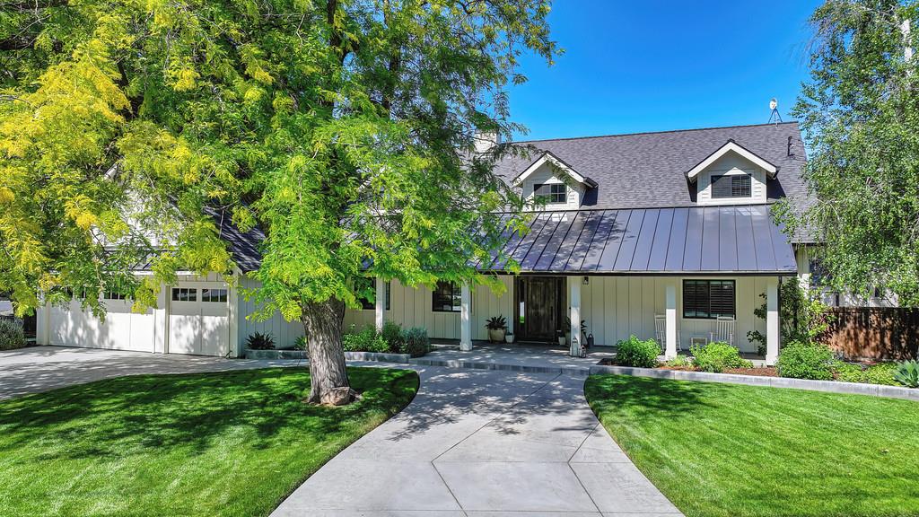 38318 Larue Way Davis, CA 95616 - Photo 4 of 92 a front view of a house with a garden