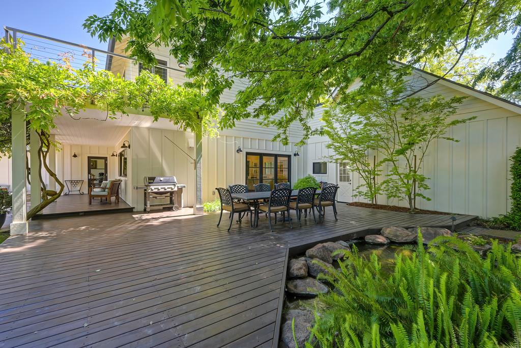 38318 Larue Way Davis, CA 95616 - Photo 66 of 92 a view of patio with table and chairs and potted plants with wooden floor and fence