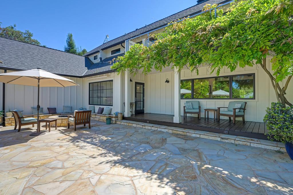 38318 Larue Way Davis, CA 95616 - Photo 71 of 92 a view of a patio with a table and chairs under an umbrella