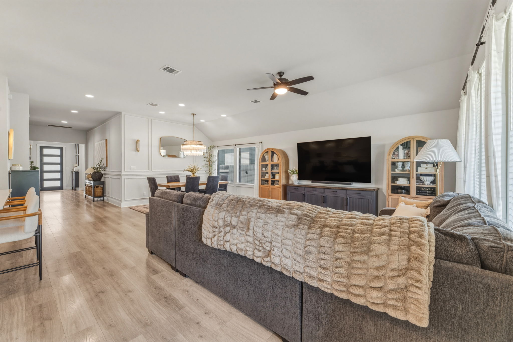 4505 Post Loop Round Rock, TX 78681 - Photo 14 of 40 Living area with recessed lighting, light wood-type flooring, a decorative wall, ceiling fan, and vaulted ceiling