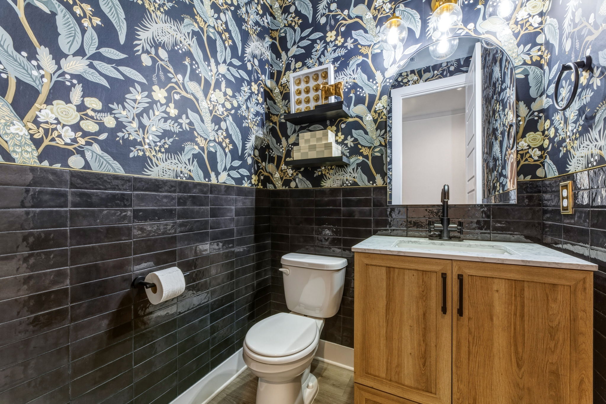 4505 Post Loop Round Rock, TX 78681 - Photo 20 of 40 Half bath with wallpapered walls, tile walls, a wainscoted wall, and vanity