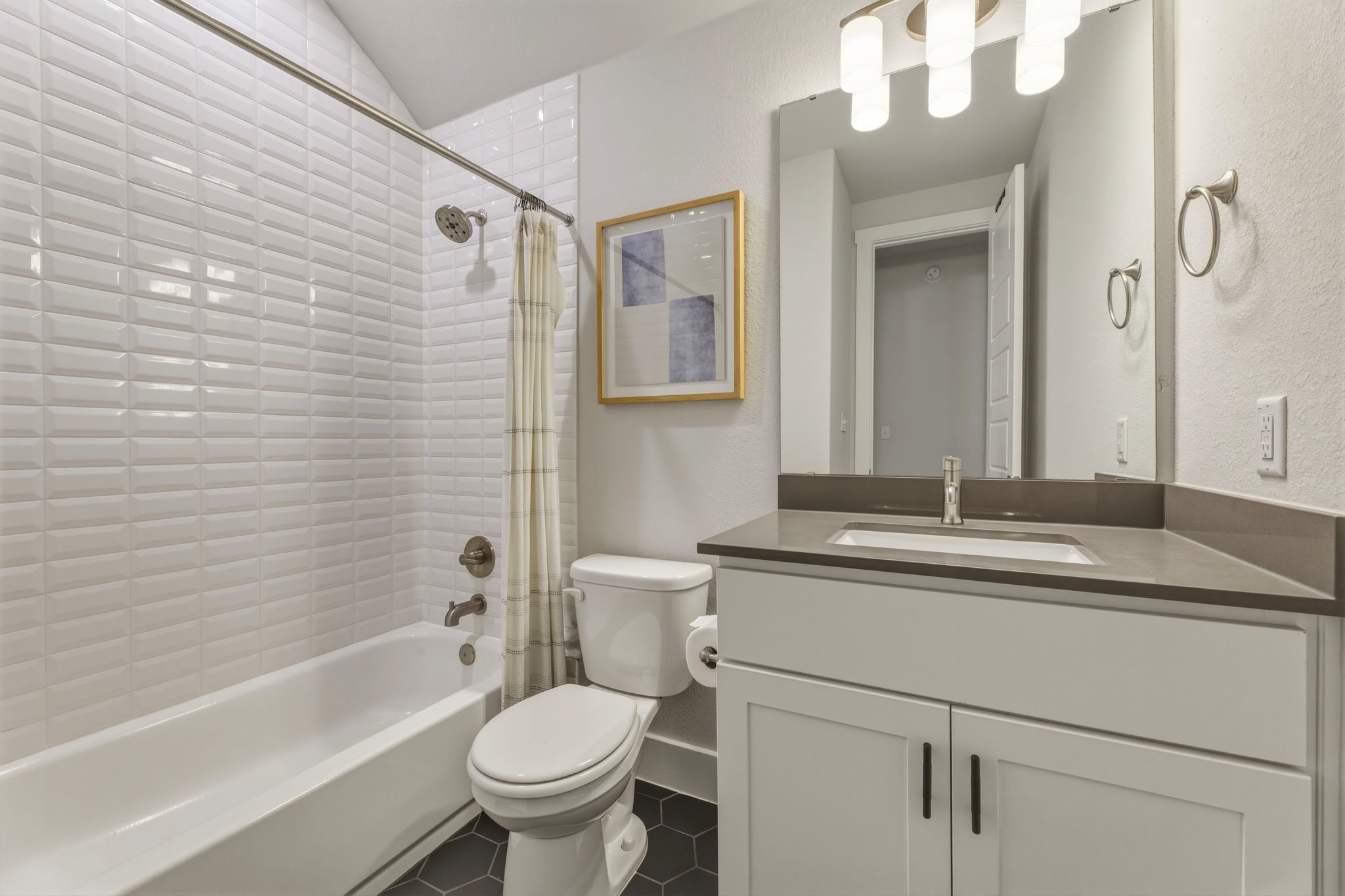 4505 Post Loop Round Rock, TX 78681 - Photo 30 of 40 Bathroom with vanity, shower / bath combo, tile patterned floors, and a textured wall