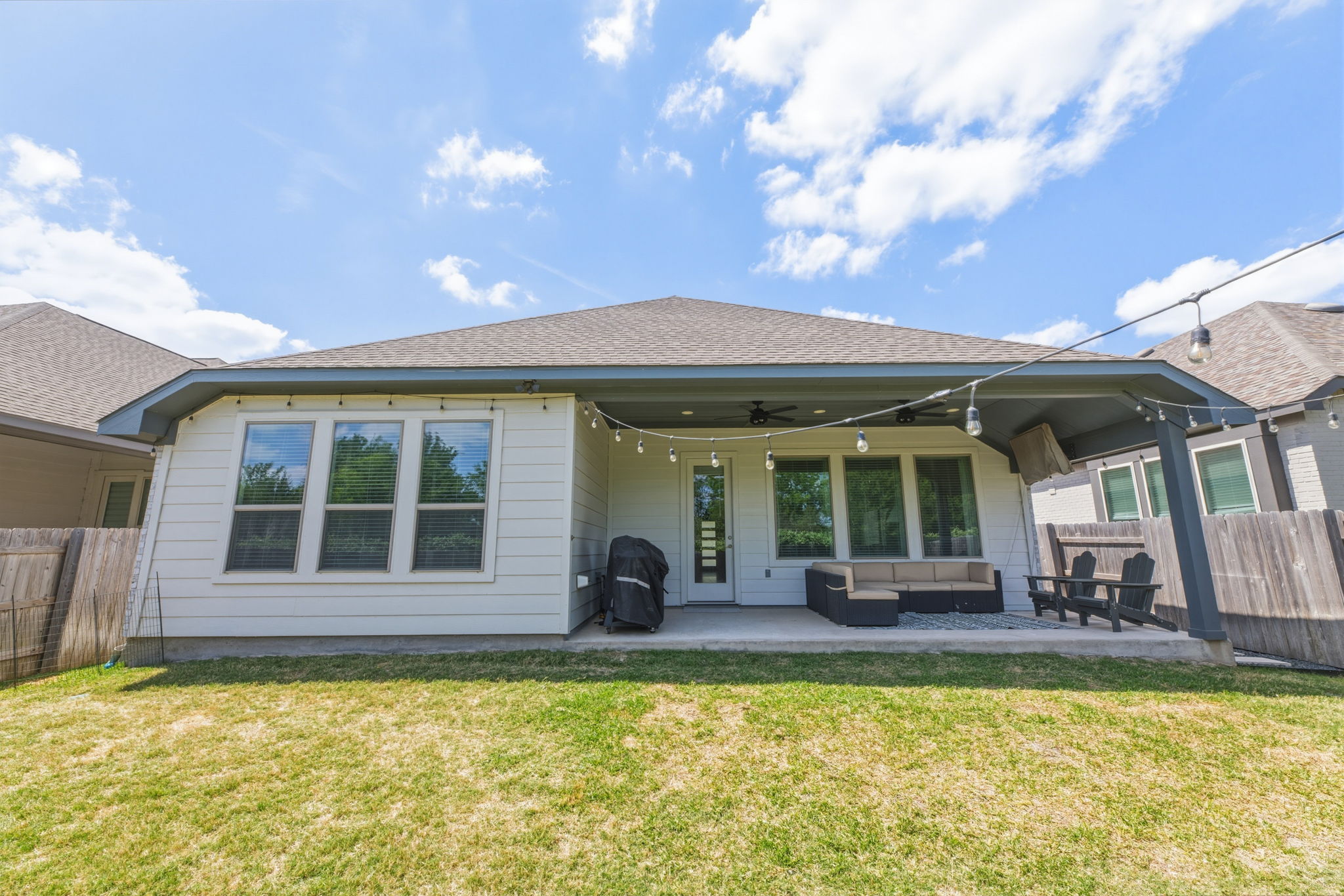4505 Post Loop Round Rock, TX 78681 - Photo 37 of 40 Rear view of property featuring a fenced backyard, a ceiling fan, a patio, an outdoor lounge area, and a shingled roof