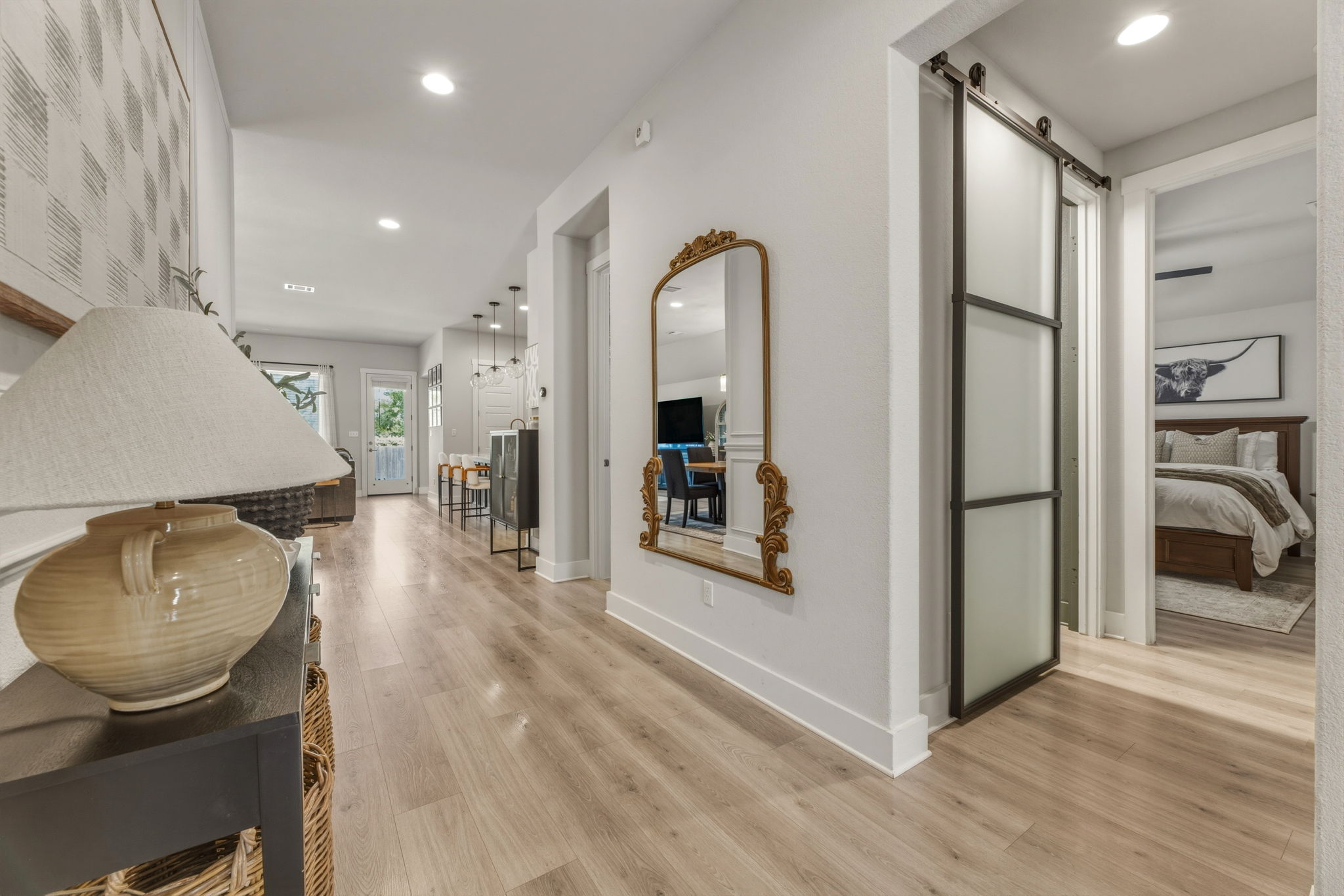 4505 Post Loop Round Rock, TX 78681 - Photo 5 of 40 Hall featuring a barn door, light wood-type flooring, and recessed lighting