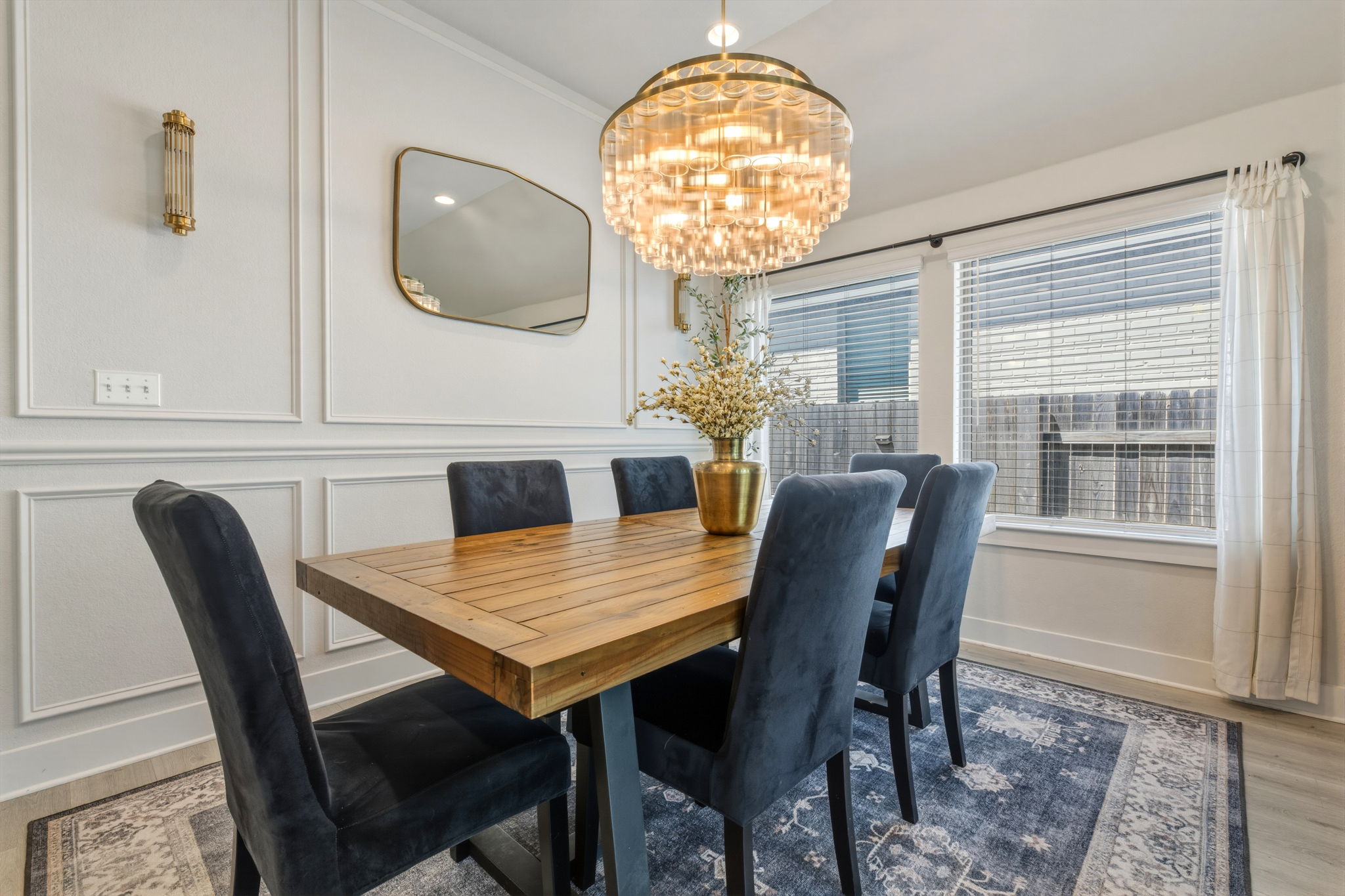 4505 Post Loop Round Rock, TX 78681 - Photo 10 of 40 Dining area featuring wood finished floors, hanging lights, and a decorative wall