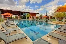 a view of a swimming pool with a patio