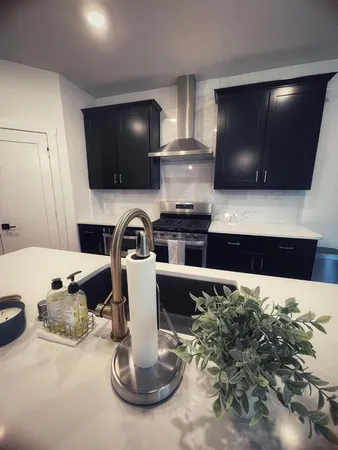 a kitchen with a table and chairs in it