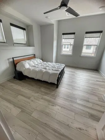 a bedroom with furniture and window