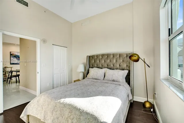 a bedroom with a bed and a table