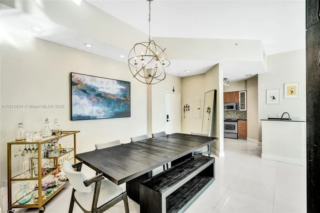 a view of a dining room furniture and wooden floor