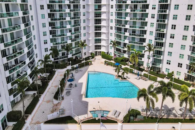 a view of a swimming pool with a patio