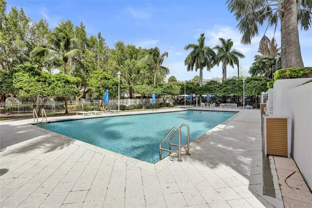 a view of a large building with a swimming pool
