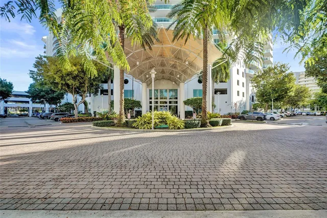 a swimming pool with outdoor seating and city view