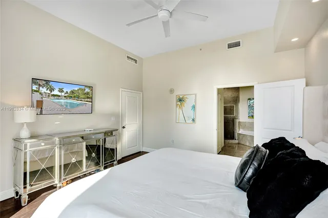 a bedroom with a bed and a cabinets