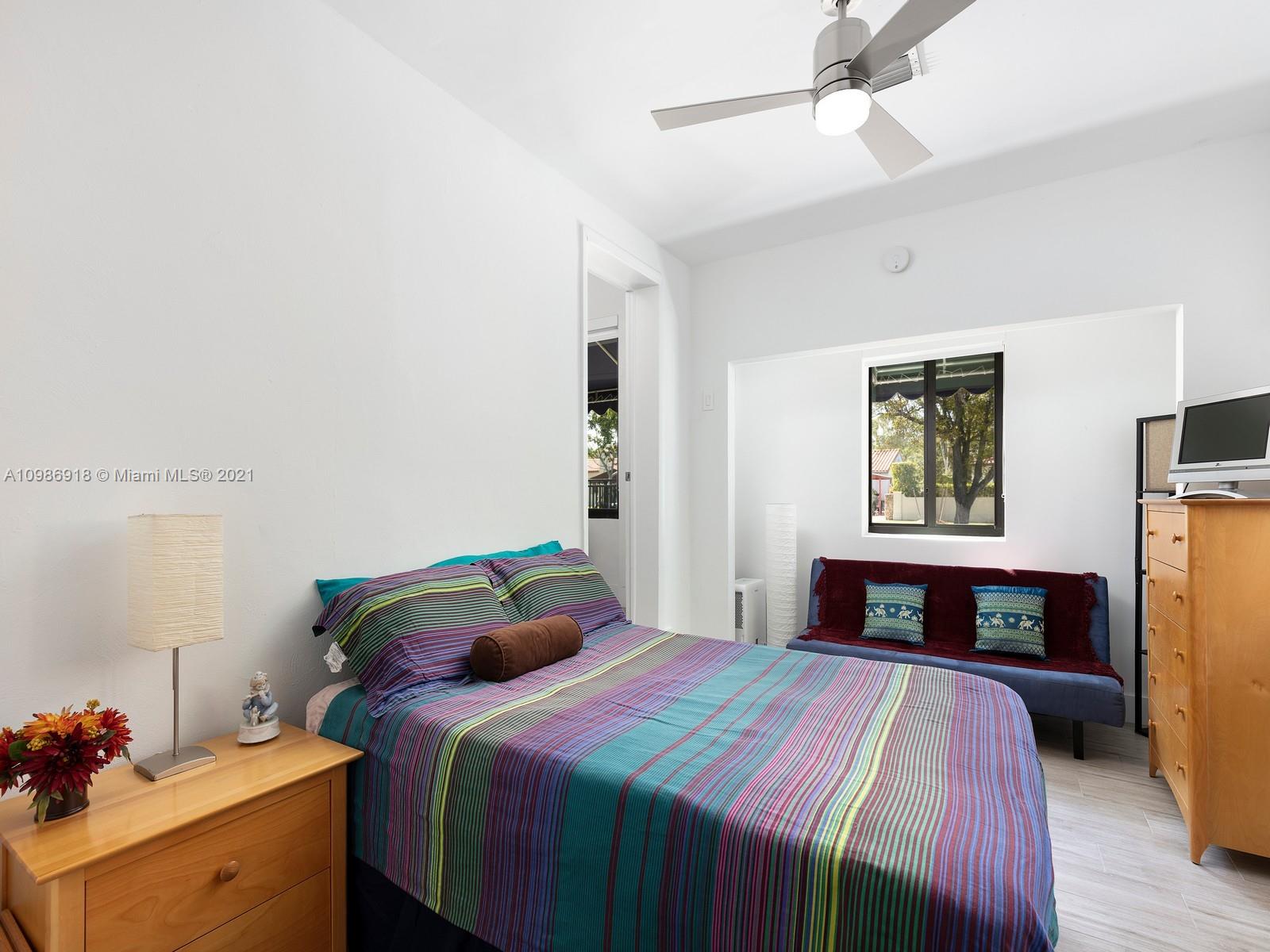 457 Southwest 27th Road Miami, FL 33129 - Photo 12 of 20 a bedroom with a bed and a window