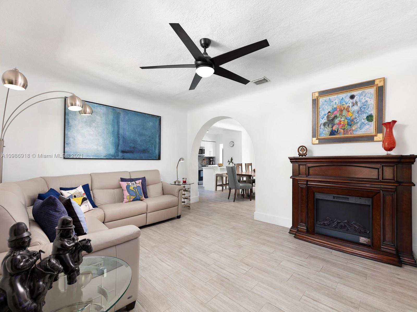 457 Southwest 27th Road Miami, FL 33129 - Photo 5 of 20 a living room with furniture and a fireplace
