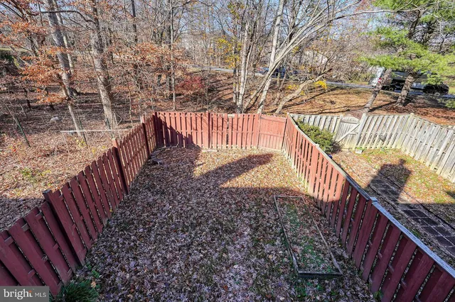 a view of balcony with wooden fence and trees