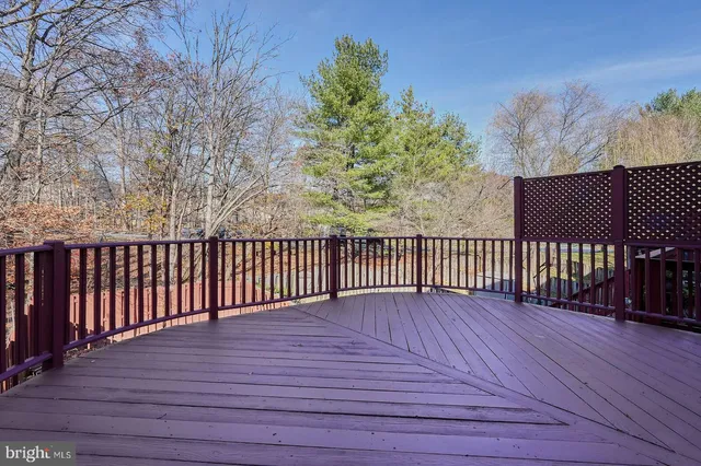 a view of wooden balcony with wooden floor and fence