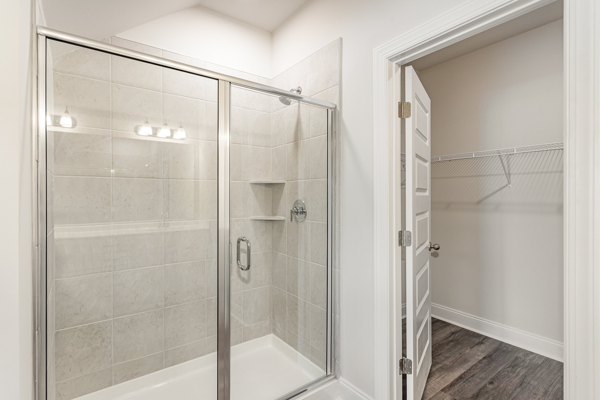 6417 Waymeet Dr Spring Hill Spring Hill, TN 37174 - Photo 10 of 26 a bathroom with a glass shower door