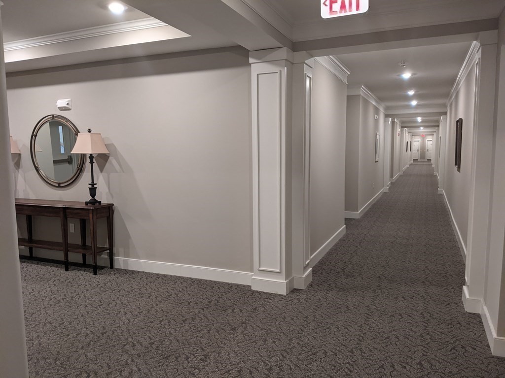 70 Trotter Road, Unit 312 Weymouth, MA 02190 - Photo 5 of 18 a view of hallway with elevator