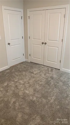 a bathroom with a toilet and a bathtub