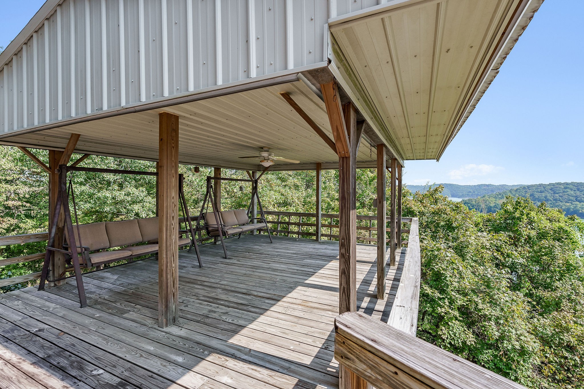 309 Cedar Hill Road Celina, TN 38551 - Photo 11 of 60 a porch with seating space