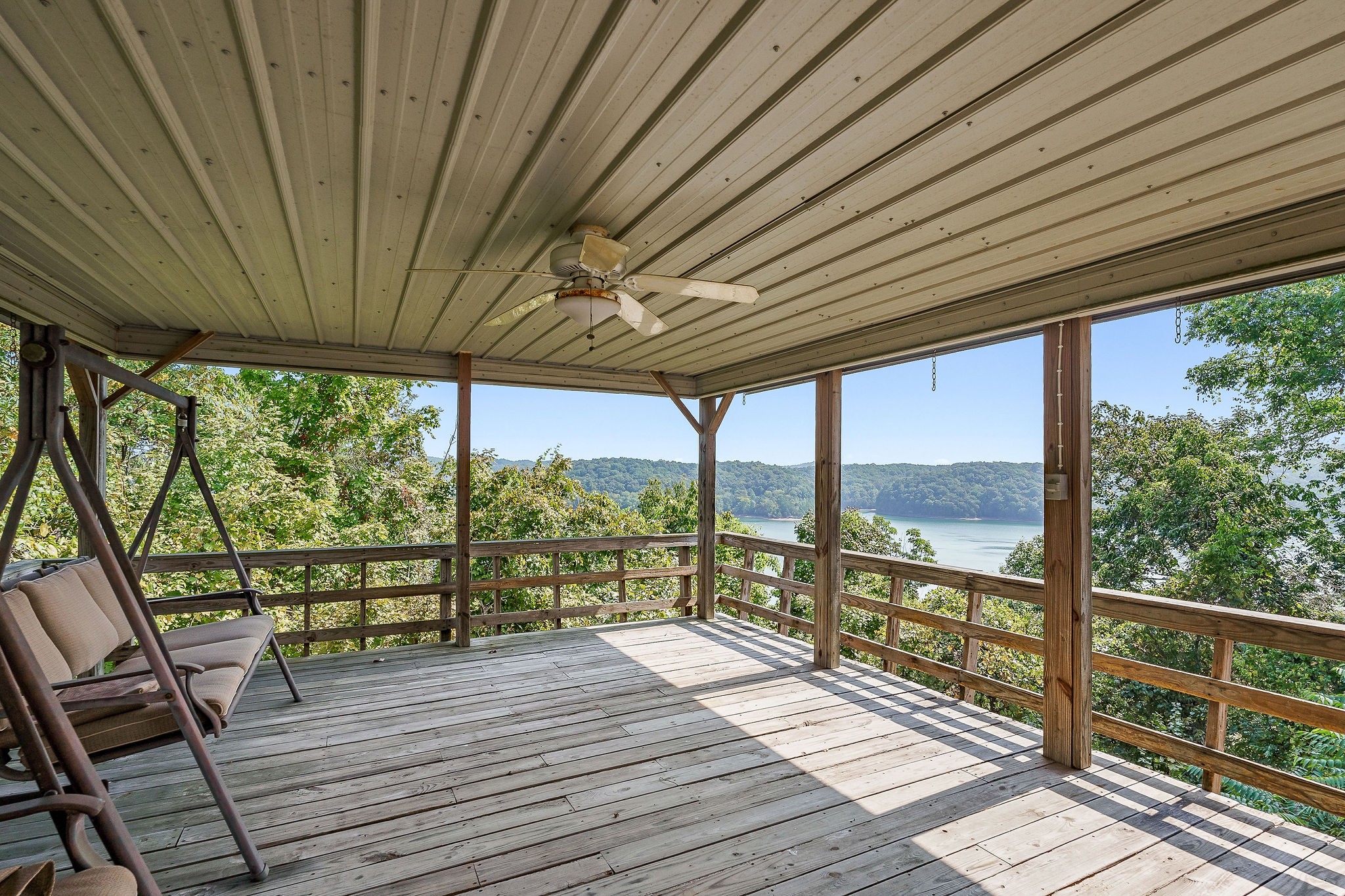 309 Cedar Hill Road Celina, TN 38551 - Photo 12 of 60 a view of a room with wooden floor and outdoor space
