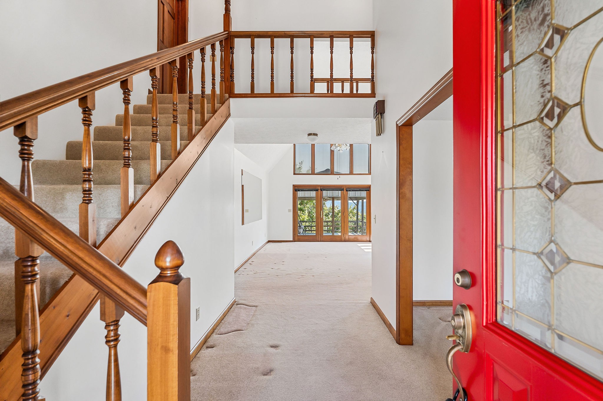309 Cedar Hill Road Celina, TN 38551 - Photo 16 of 60 a view of staircase with lots of frames on wall and a window