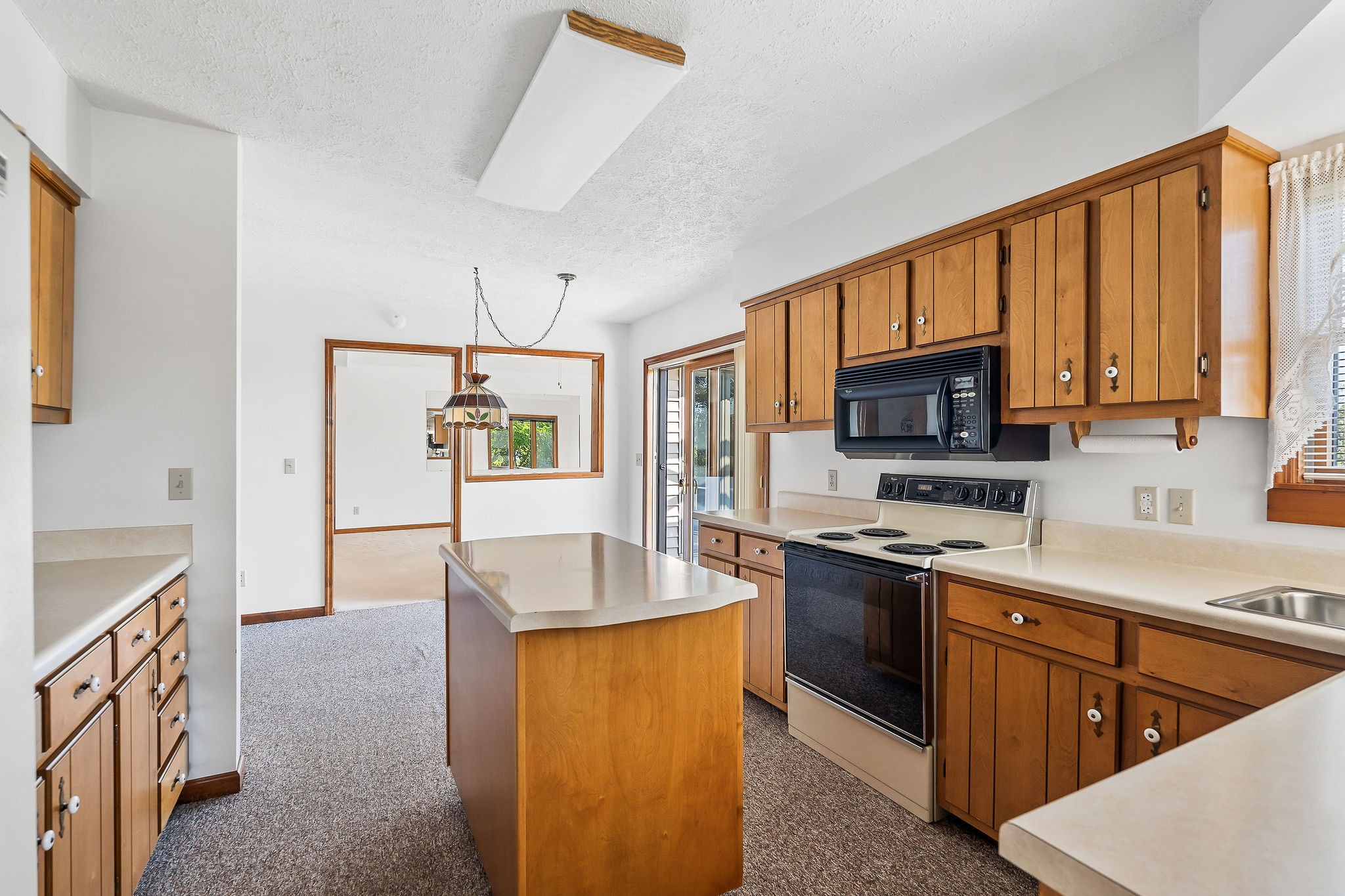 309 Cedar Hill Road Celina, TN 38551 - Photo 29 of 60 a kitchen with stainless steel appliances granite countertop a stove top oven a sink dishwasher a refrigerator and a microwave