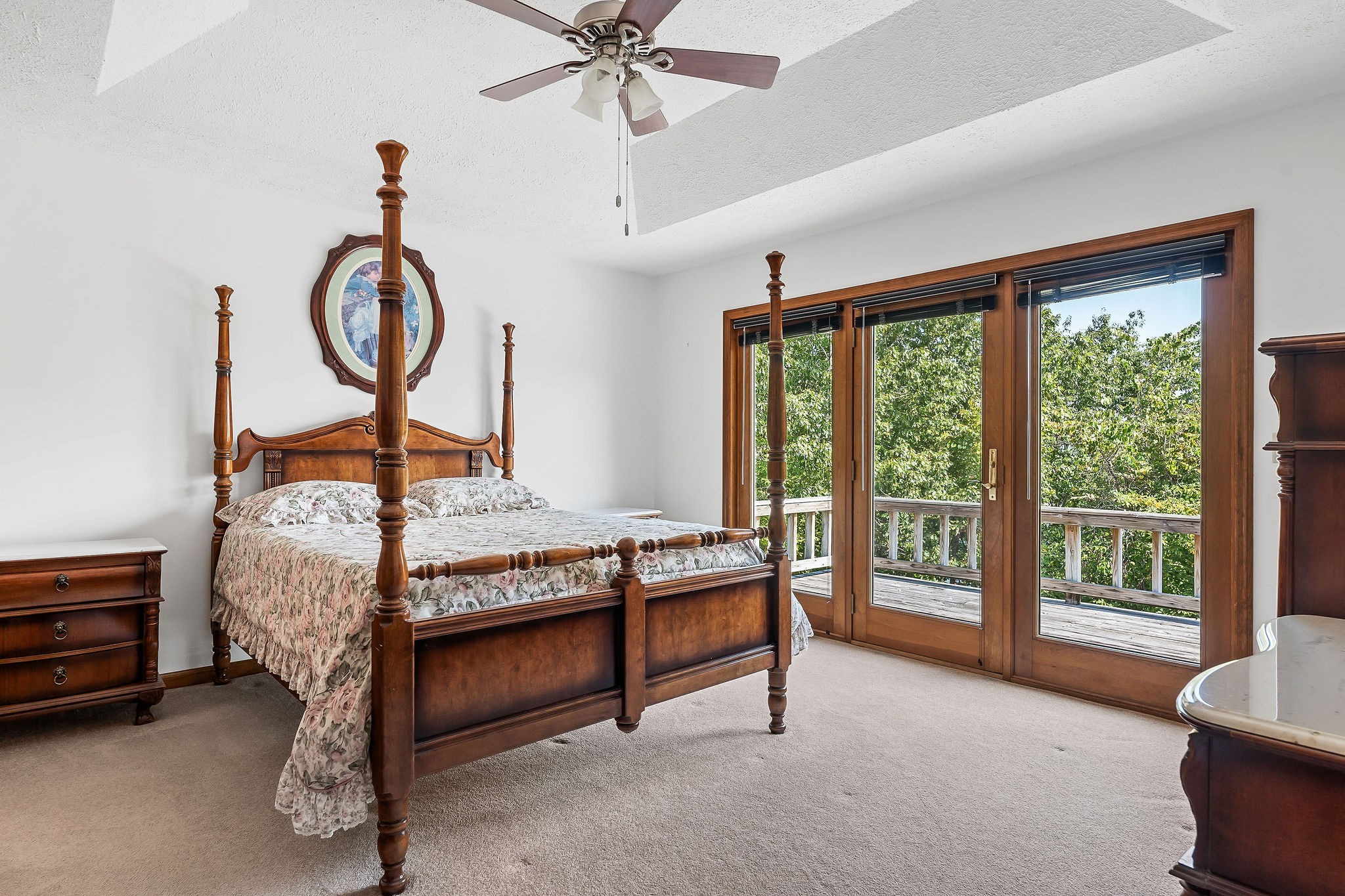 309 Cedar Hill Road Celina, TN 38551 - Photo 33 of 60 a bed sitting in a room next to a window